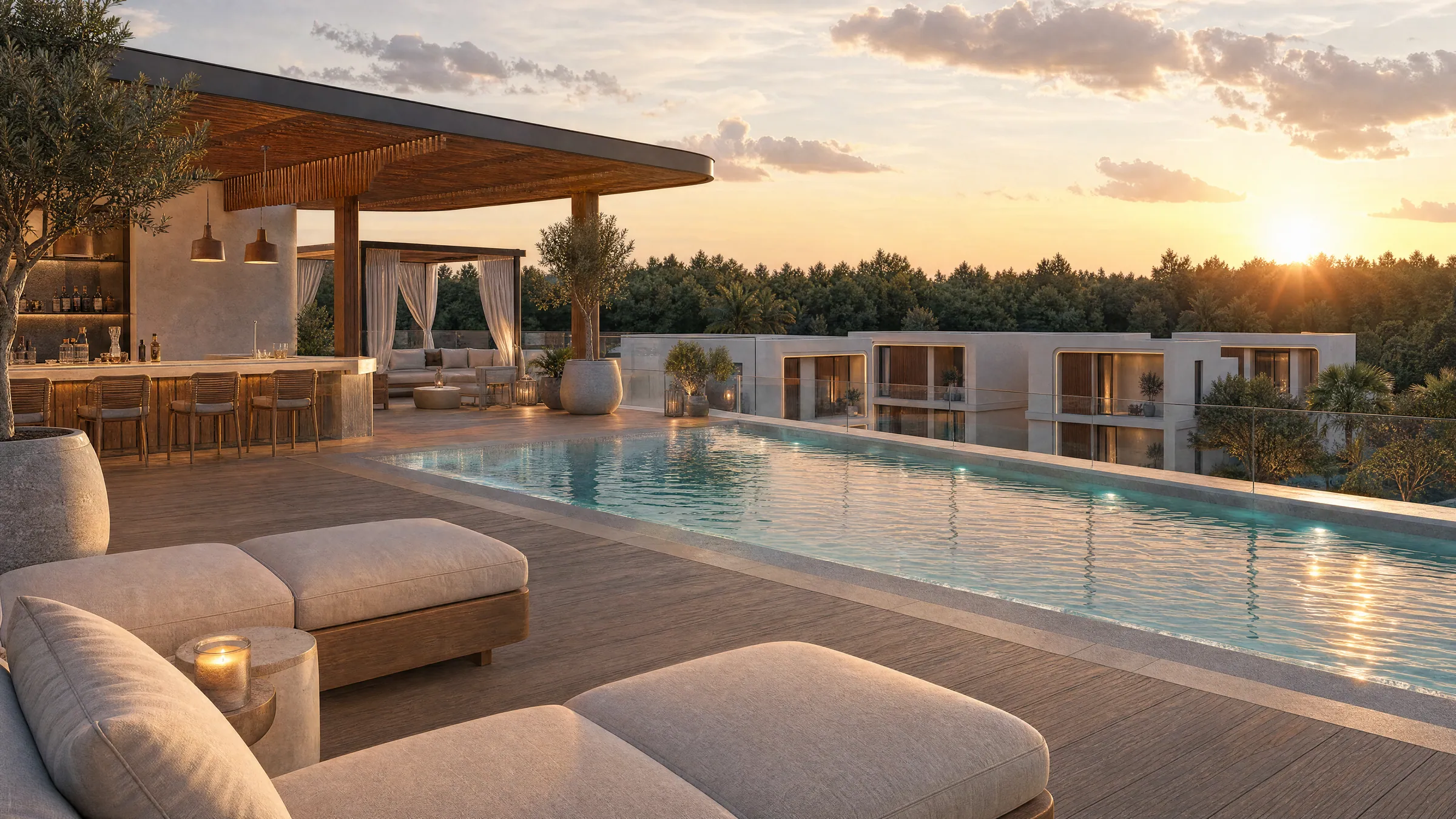 The rooftop pool at sunset, with loungers, a bar under a timber pergola, and villas and forest beyond