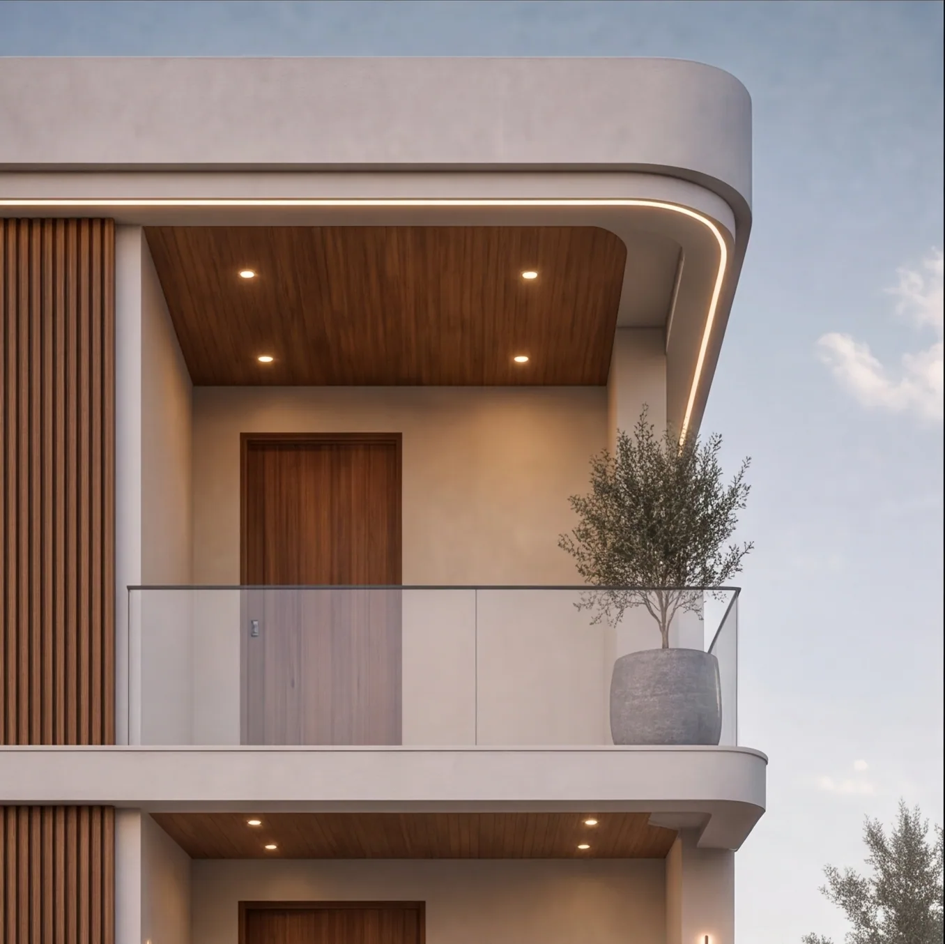 The top balcony with a timber soffit and a warm LED cove line following the rounded frame